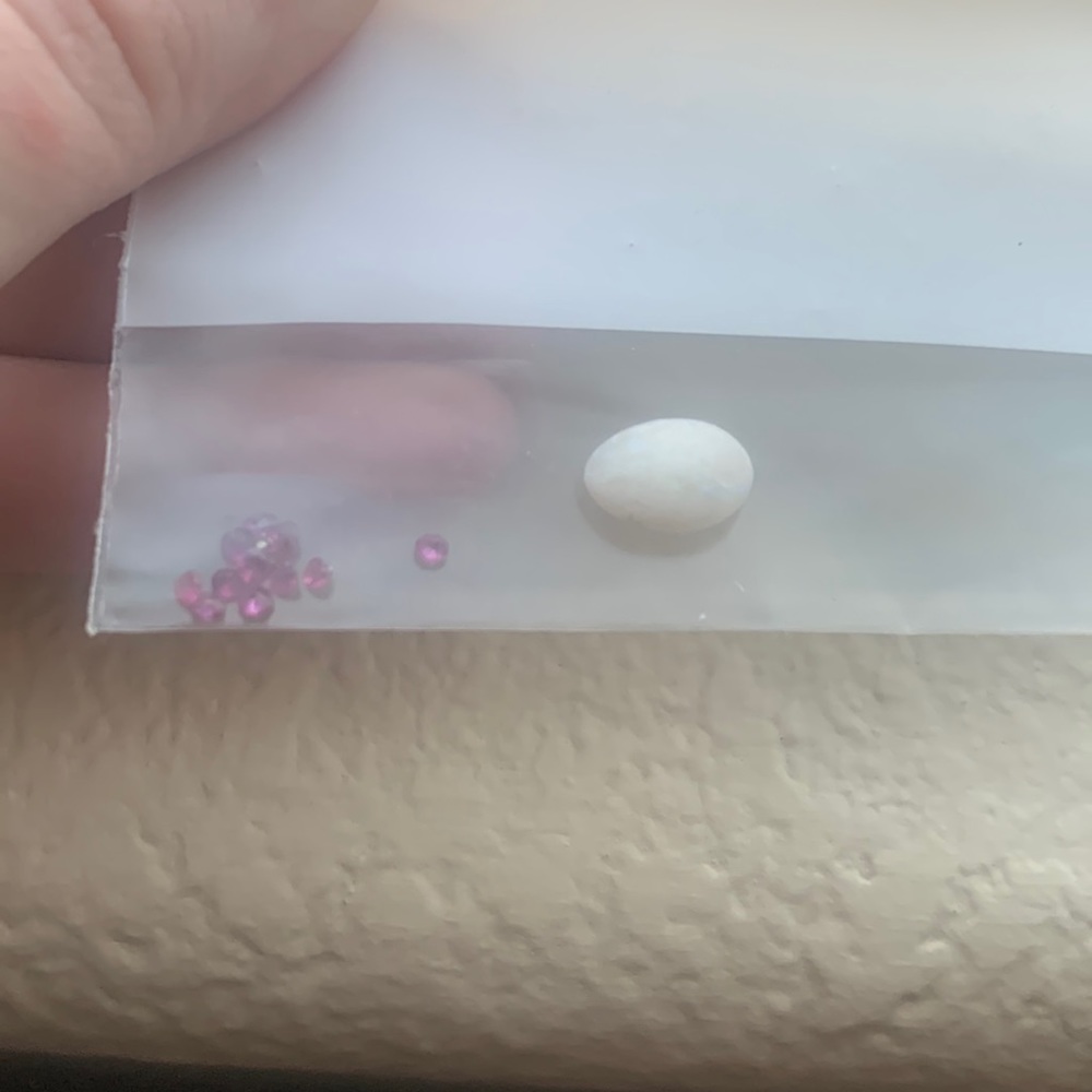 Genuine white opal and rubies, ready for setting in a ring